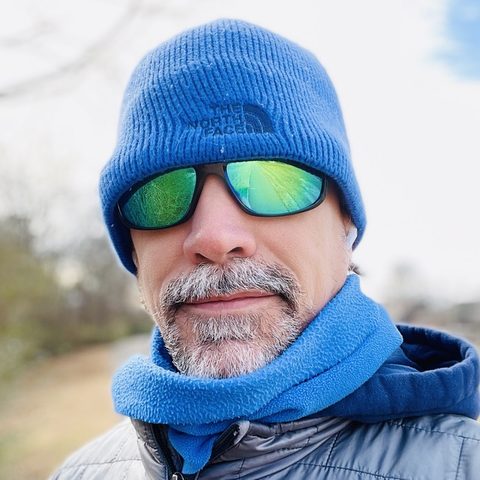 Shawn Bierman in a blue beanie and green mirrored sunglasses